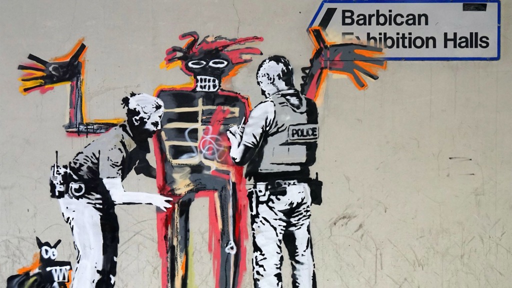 Banksy Jean MIchel Basquiat controle au facies
